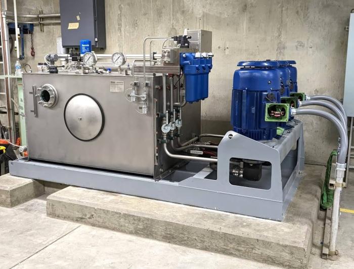 Custom hydraulic power unit with stainless steel reservoir at hydroelectric dam