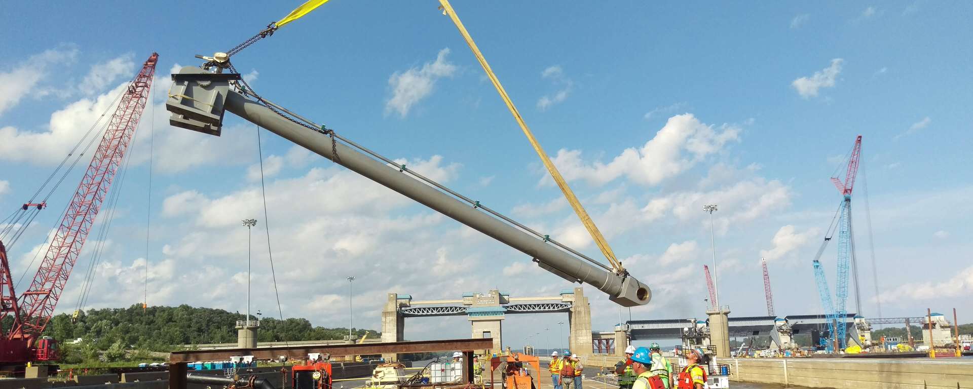 Custom large hydraulic cylinder being lifted by crane