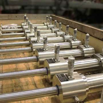 Subsea stainless steel, double rod custom cylinders being prepared for shipment in a crate