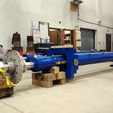 Two long stroke hydraulic cylinders with engineered gimbals and liquid-tight bulkhead rod penetrations for dam gate hoist